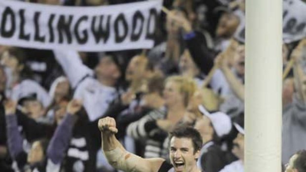 Collingwood's Darren Jolly celebrates a goal, and victory, against West Coast at Etihad Stadium.