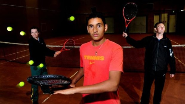Nick Kyrgios with Canberra tennis identities Alun Jones, left, and Todd Larkham, right.