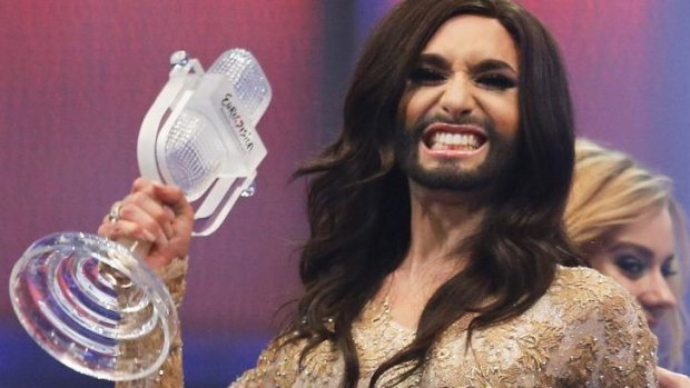 Austria's Conchita Wurst celebrates with the trophy after winning the Eurovision Song Contest.
