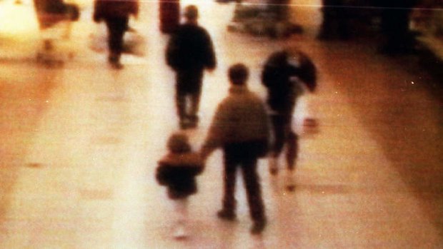 Chilling: The 1993 video image that showed James Bulger, 2, on the left, being led away by his killer in the New Strand shopping centre in Liverpool.