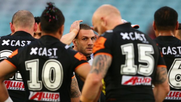 Talks: Robbie Farah with his Wests Tigers teammates.