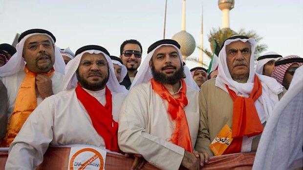 Stand-off &#8230; a former parliamentary speaker, Ahmed Al-Sadoun, right, with protesters.
