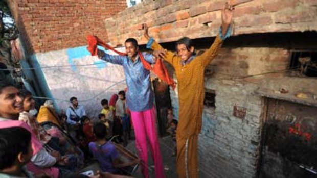 Tall tales ... Kathputli slum dwellers put on an impromptu performance, showcasing some of their special talents.
