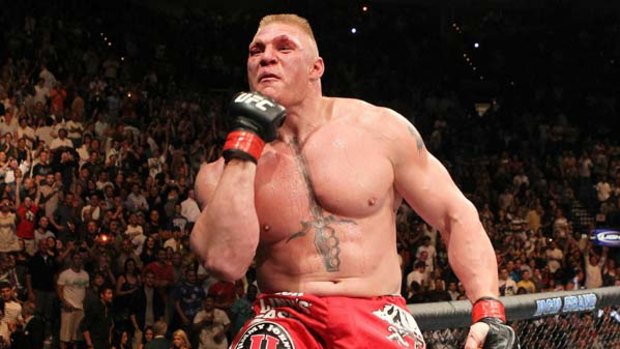 Brock hard ... UFC heavyweight champion Brock Lesnar celebrates his second-round title victory against Shane Carwin in Las Vegas.