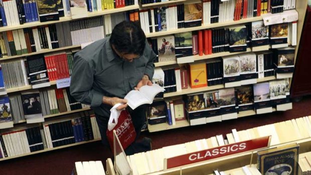 A customer browses in a Dymocks Books store.