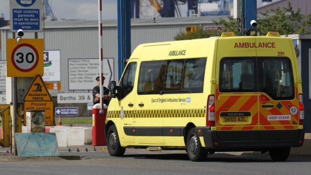 An ambulance arrives at the entrance to Tilbury Docks on Saturday.