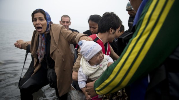 Refugees arrive on Lesbos on Wednesday.