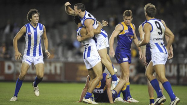 Brent Harvey celebrates a goal during his best-on-ground performance.