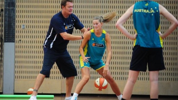 Call up: Retired Australian professional basketball player Luc Longley coaches Carley Mijovic of the Canberra Capitals.