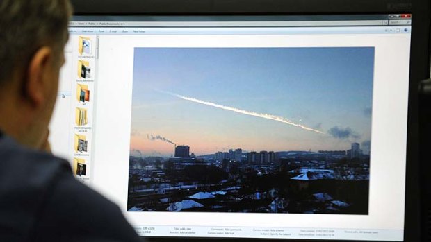 A Russian man watches the meteor.