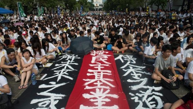 Students protest against Beijing's conservative framework for political reform in Hong Kong.