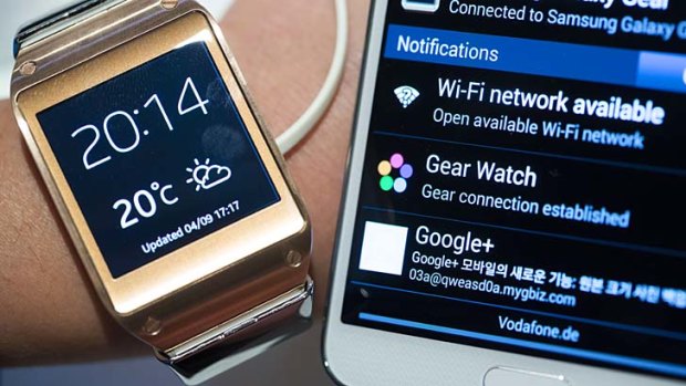 The Samsung Galaxy Gear, left, works in tandem with the new Samsung Galaxy Note 3.