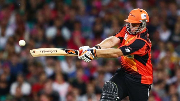 Scorching century: The Scorchers' Craig Simmons hits out against the Sixers.