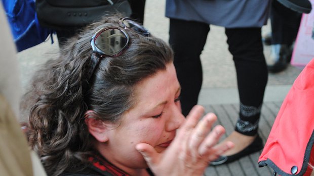 Mother Rebecca O’Brien breaks down outside parliament after a motion for more funding is denied.