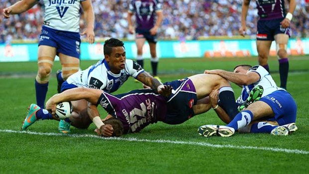 Execution ... the Storm's plan to target the Bulldogs five-eighth Josh Reynolds pays off as early as the seventh minute when Ryan Hoffman crashes over for the opening try.