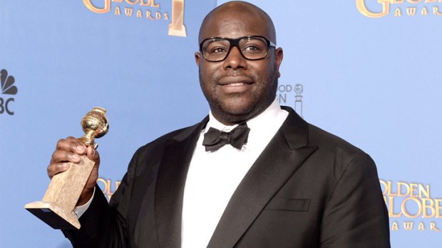 Last laugh ... <i>12 Years a Slave</i> director Steve McQueen collects the Golden Globe for best movie drama.