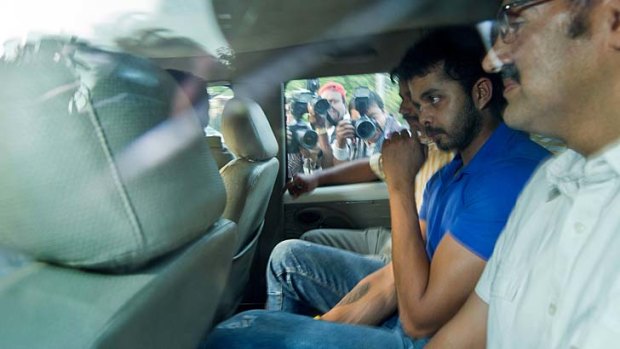 Refused bail: Indian cricketer Shanthakumaran Sreesanth, centre.
