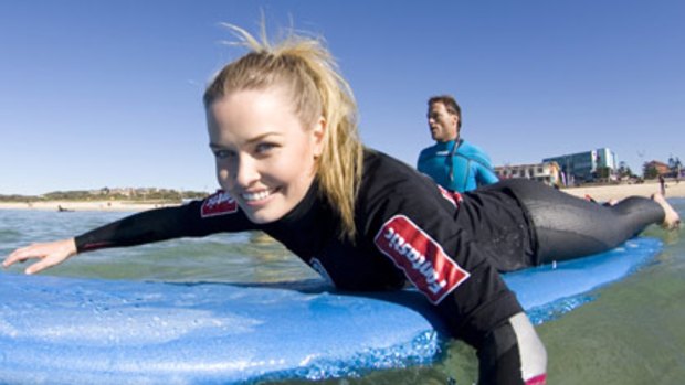 All in a day's promotion ... Lara Bingle at Maroubra Beach.