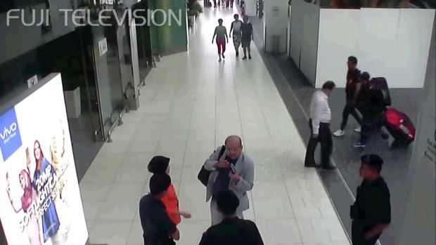 CCTV footage shows Kim Jong-nam speaking with Kuala Lumpur airport officials after the attack.