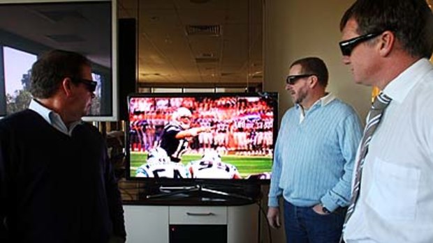 Glimpse of the future ... Nine's head of sport Steve Crawley, producer Graeme Koos and operations manager Geoff Spark watch an NFL broadcast in 3D at Nine's Artarmon headquarters.