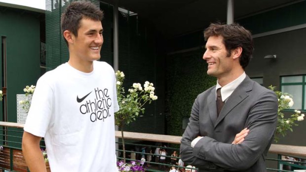 Pep talk ... Bernard Tomic chats with fellow Australian Mark Webber at Wimbledon this week.