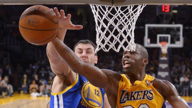 Los Angeles Lakers guard Jodie Meeks has his shot blocked by Golden State Warriors centre Andrew Bogut in Los Angeles. The Warriors won 112-95.