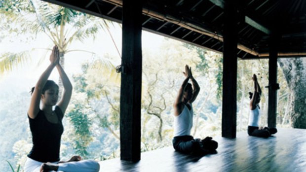 Breathe deeply ... practising yoga in Ubud.