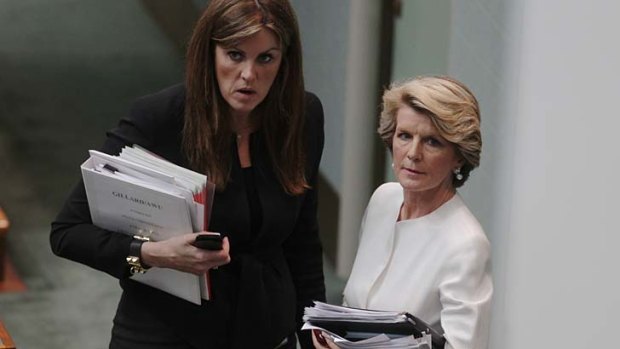 Debrief ... Peta Credlin, left, Tony Abbott's chief of staff, and Julie Bishop meet after Question Time.
