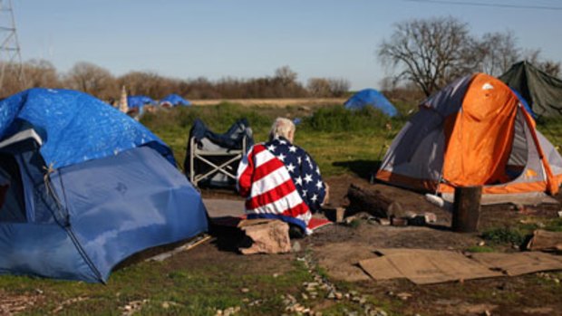 Star-spangled camper ... a homeless man in a temporary tent city in Sacramento, California