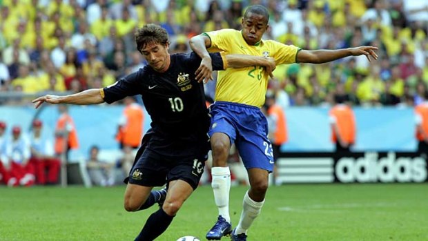Australian Socceroo Harry Kewell battles for the ball with Brazil's Robinho at the 2006 World Cup.