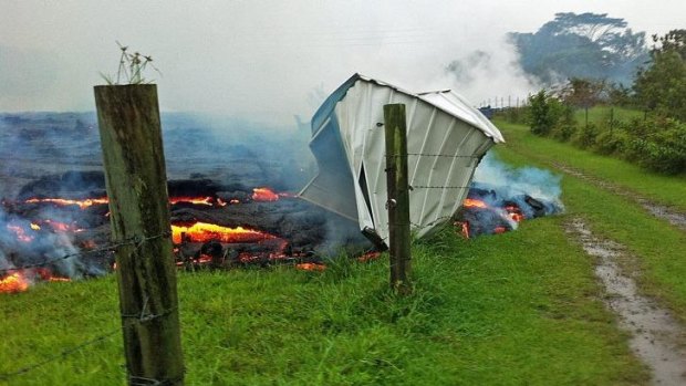 Gotcha: A small shed is consumed by the lava flow near Pahoa village on the Big Island.