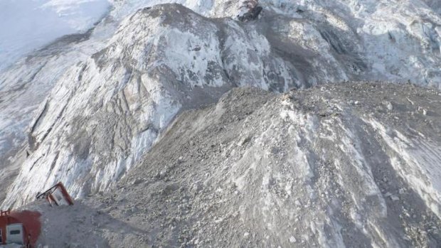 A New Zealand Department of Conservation alpine hut is engulfed by an avalanche that hit Mount Cook on New Zealand's South Island on Wednesday.