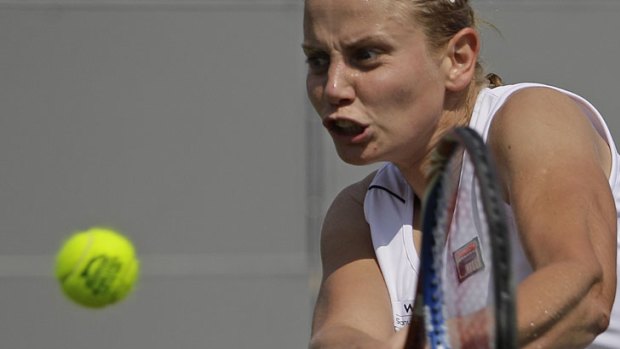 Trials and tribulations ... Jelena Dokic in action in the Netherlands on Thursday.
