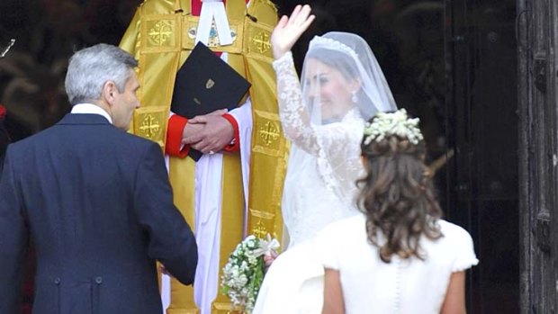 That dress ...  Pippa Middleton, nearest camera, helps her sister Kate before her marriage to Britain's Prince William.