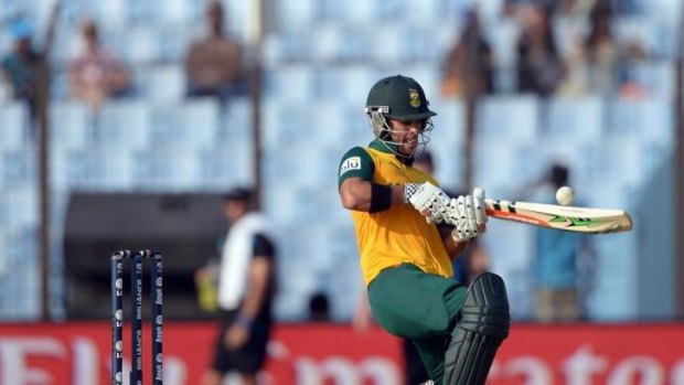 J.P. Duminy plays an unorthodox stroke during his innings of 86.