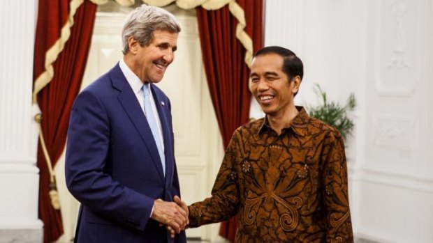 US Secretary of State John Kerry (left) meets Indonesian President Joko Widodo after a bilateral meeting at Presidential Palace.