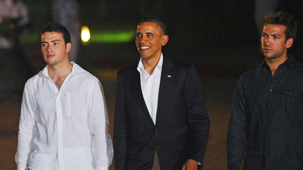 The sons of Colombian President Juan Manuel Santos Calderon escort Barack Obama as he arrives at the government retreat for dignitaries in Cartagena, Colombia.