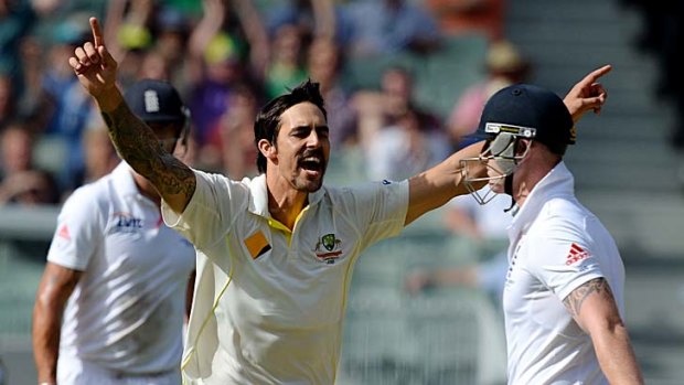 Got him: Mitchell Johnson delights in the wicket of Ben Stokes.