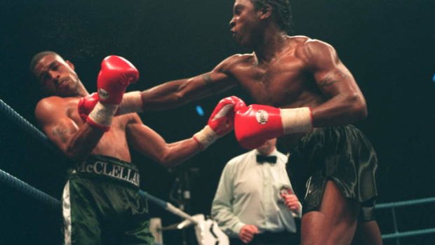 Benn throws a right at Gerald McClellan in their 1995 super-middleweight fight at the London Arena.
