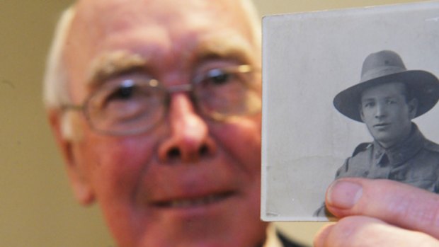 John Buckley holding a picture of his famous uncle.