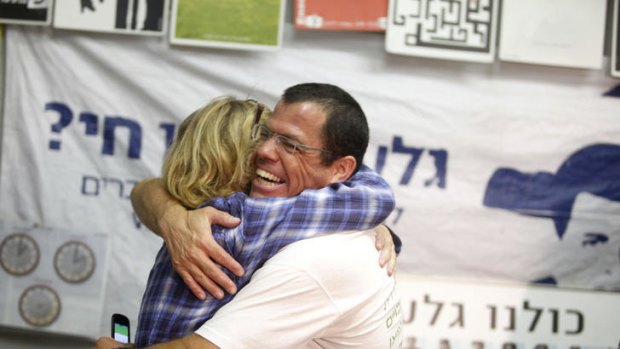 Israeli activists hug in a protest tent for Israeli soldier Gilad Schalit, set up outside the Prime Minister's residence in Jerusalem.