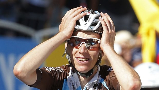 Frenchman Romain Bardet celebrates as he crosses the finish line to win the 18th stage in Saint-Jean-de-Maurienne in the French Alps.