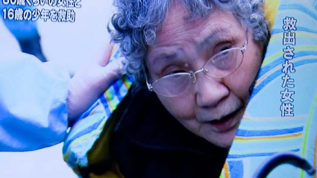 TV footage ... one of the survivors, 80, who was trapped in her kitchen with her grandson. They ate food from the fridge.