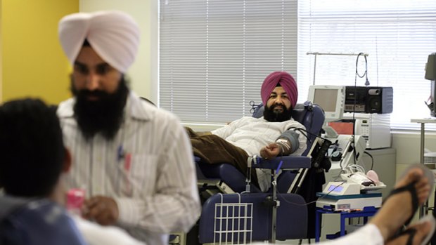 Amarjeet Singh, a Sikh, gives blood in Melbourne yesterday.