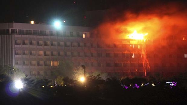 Kabul's five-star Intercontinental Hotel, frequented by Afghan officials and visiting diplomats, burns after the attack by Taliban fighters.