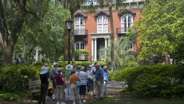 Tourists gather outside Mercer-Williams House in Savannah.