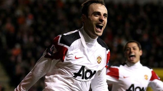 Dimitar Berbatov of Manchester United celebrates after scoring the winner.