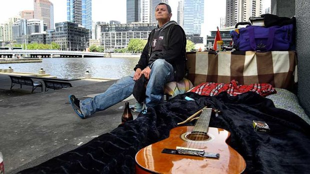 Wayne Perry in his encampment under a CBD bridge. He died just days after this photo was taken.