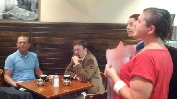 Given a serve ... gay activists confront Tony Abbott in a Melbourne restaurant.