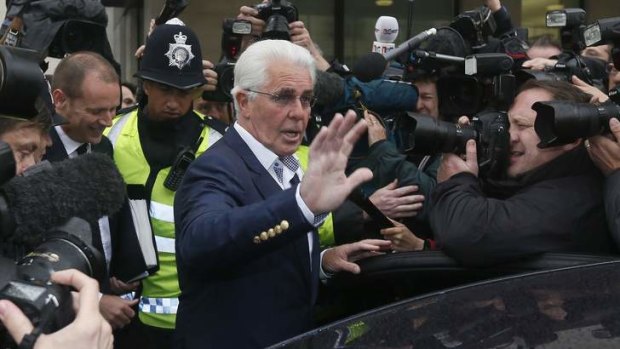 In the spotlight: Max Clifford leaves Westminster Magistrates Court after pleading not guilty to 11 counts of indecent assault.